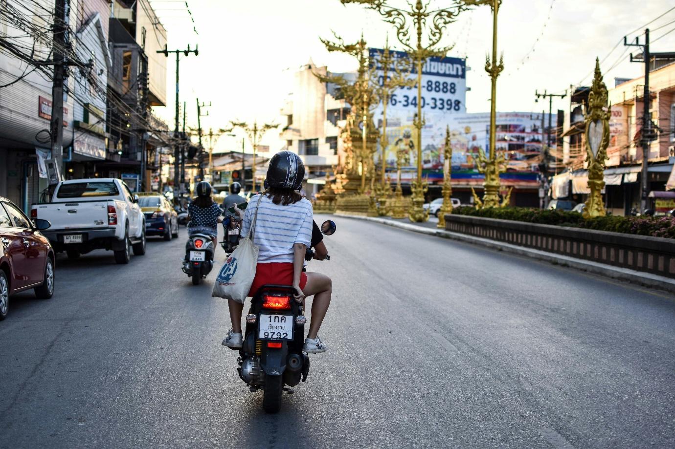 A person on a motorcycle AI-generated content may be incorrect.
