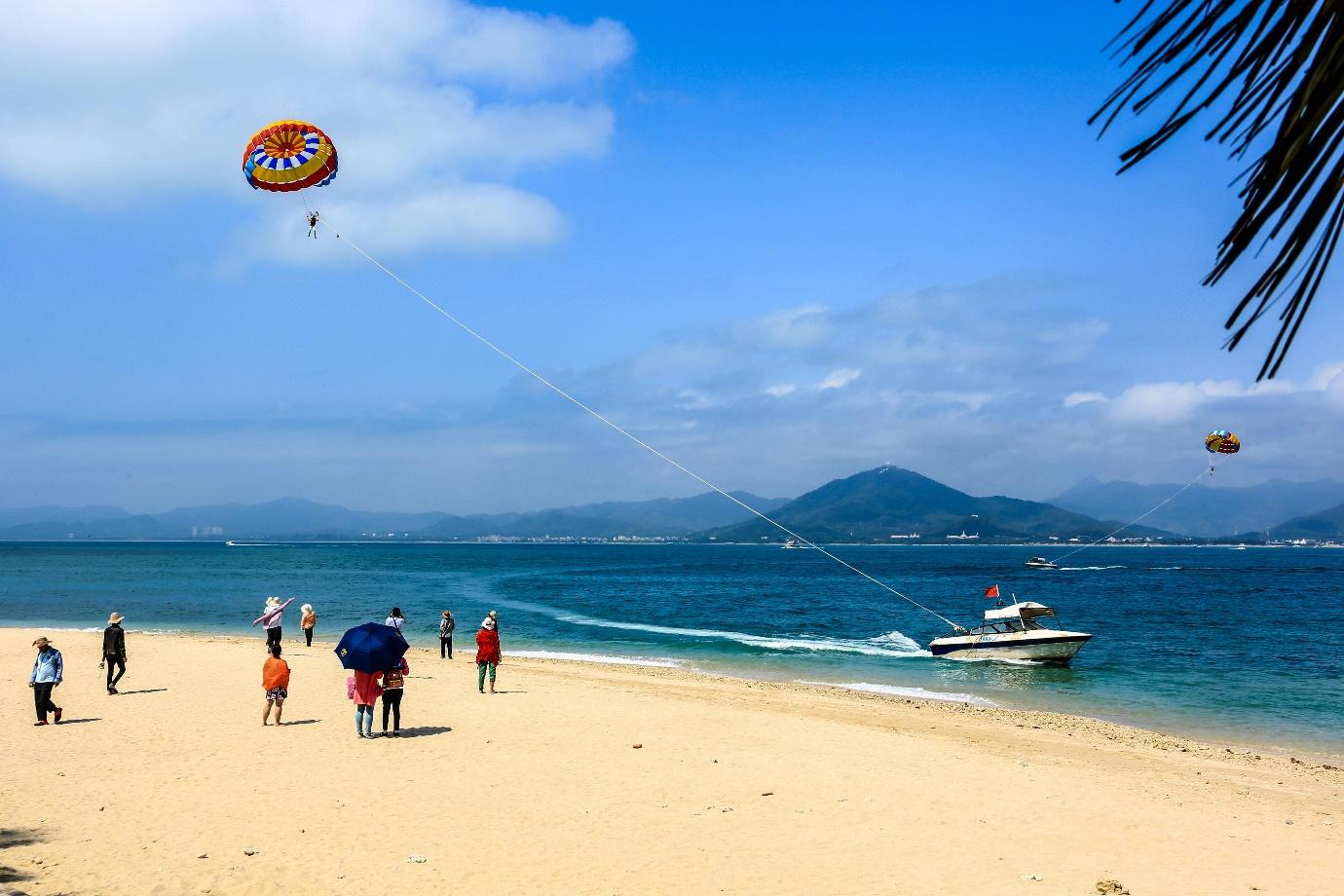 A group of people on a beach AI-generated content may be incorrect.
