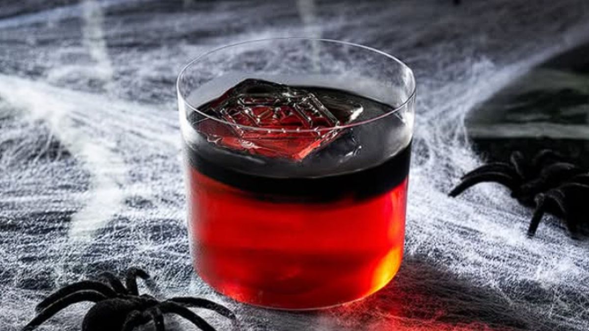 red and black drink with halloween-themed decorations 