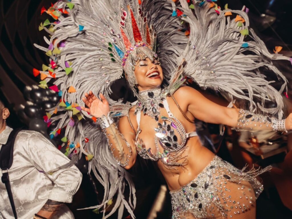 New Year’s Eve countdown party with samba dancers and skyline views.
