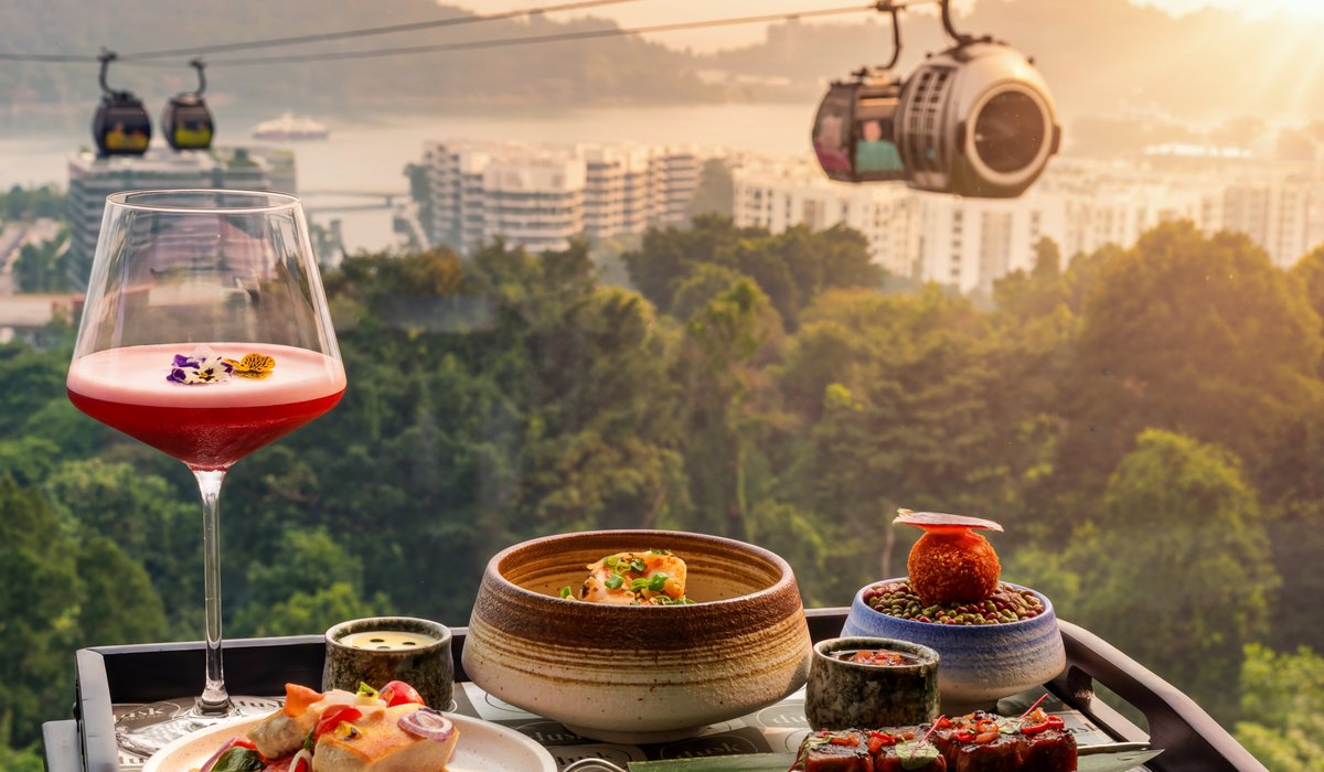 Sunset cocktails and bites with cable car views at Dusk Mount Faber Peak, one of the best affordable romantic restaurants in Singapore
