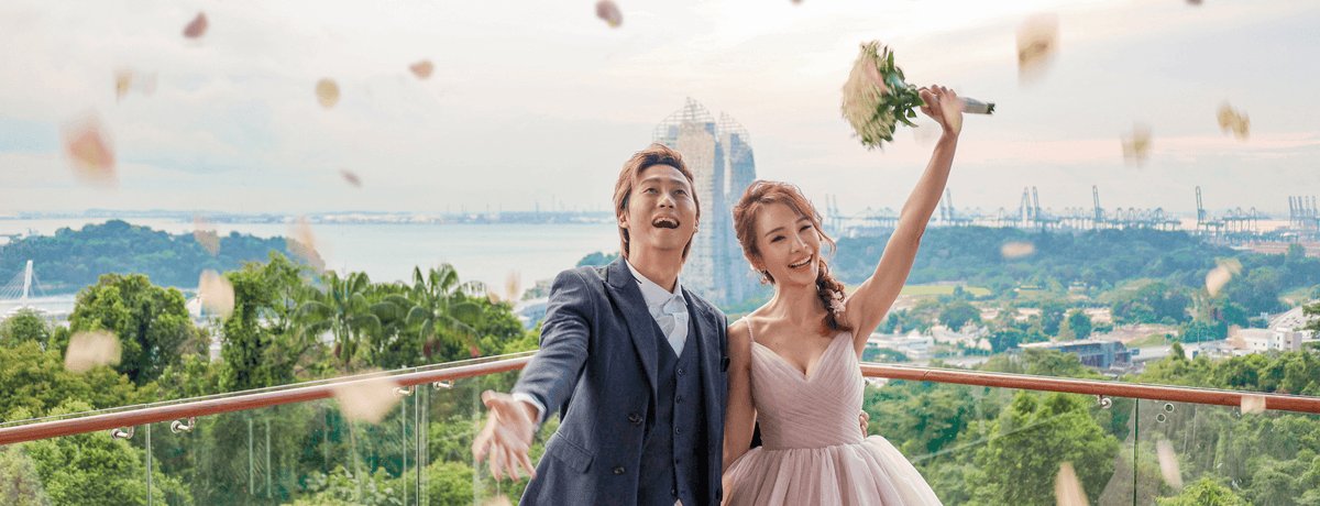 Couple celebrating their wedding on the hilltop at Arbora, Mount Faber Peak