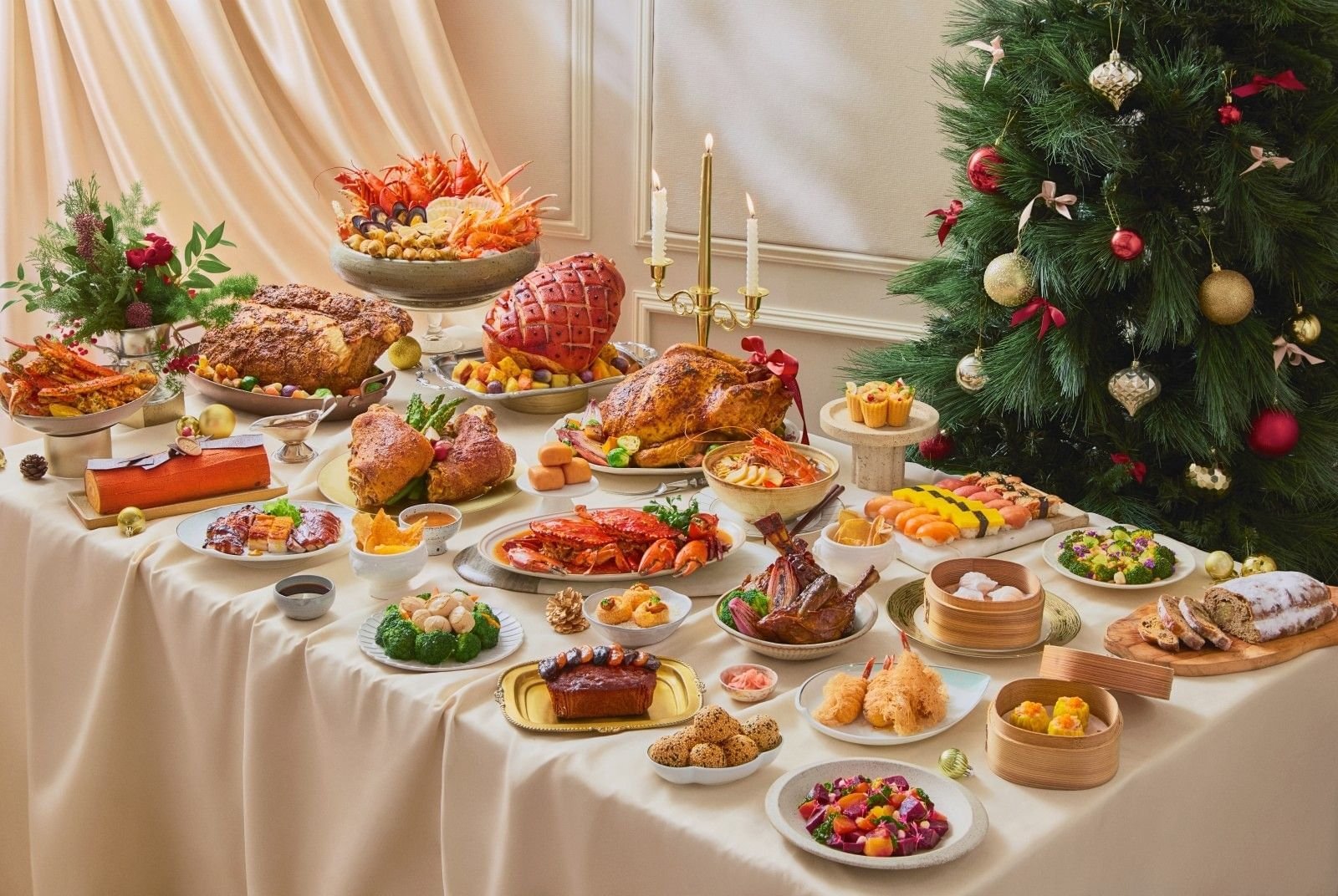 Christmas buffet spread with roast turkey, glazed ham, seafood and a decorated Christmas tree at The Fullerton Hotel Singapore