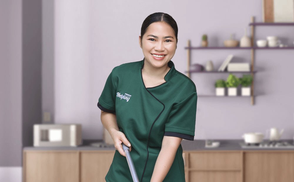 Helpling cleaner vacuuming a living room in Singapore