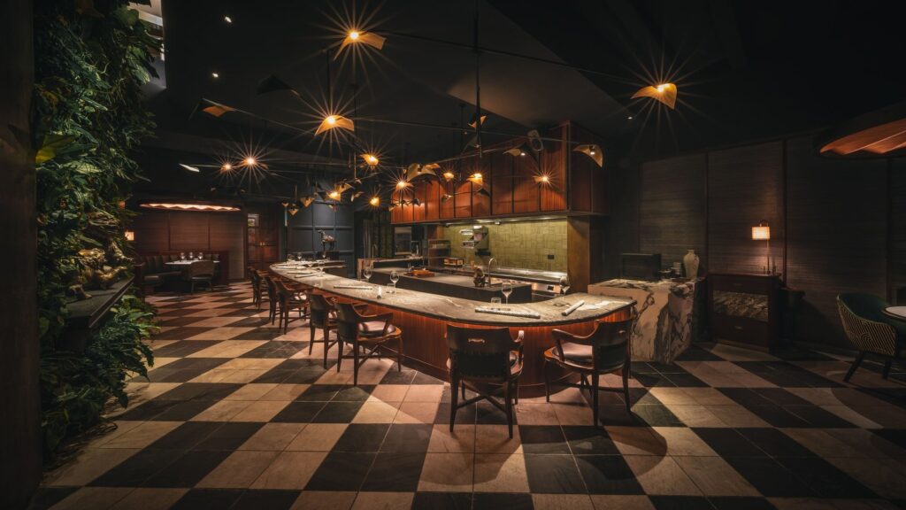 The candlelit dining room and counter at Cloudstreet on Amoy Street
