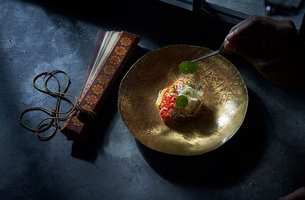 A dish being plated at Cloudstreet
