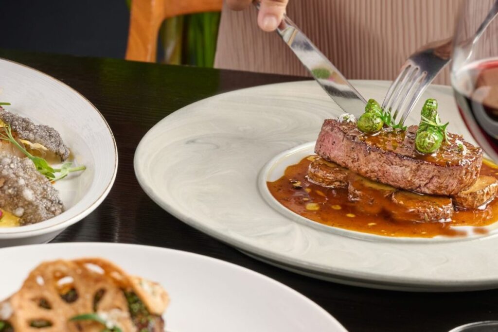 A grilled steak with red wine at SKAI
