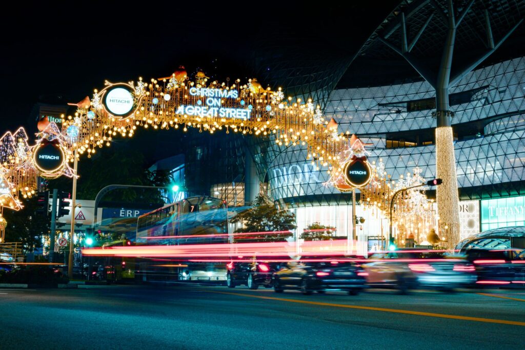 Light trails along the Orchard Road Christmas light-up at night